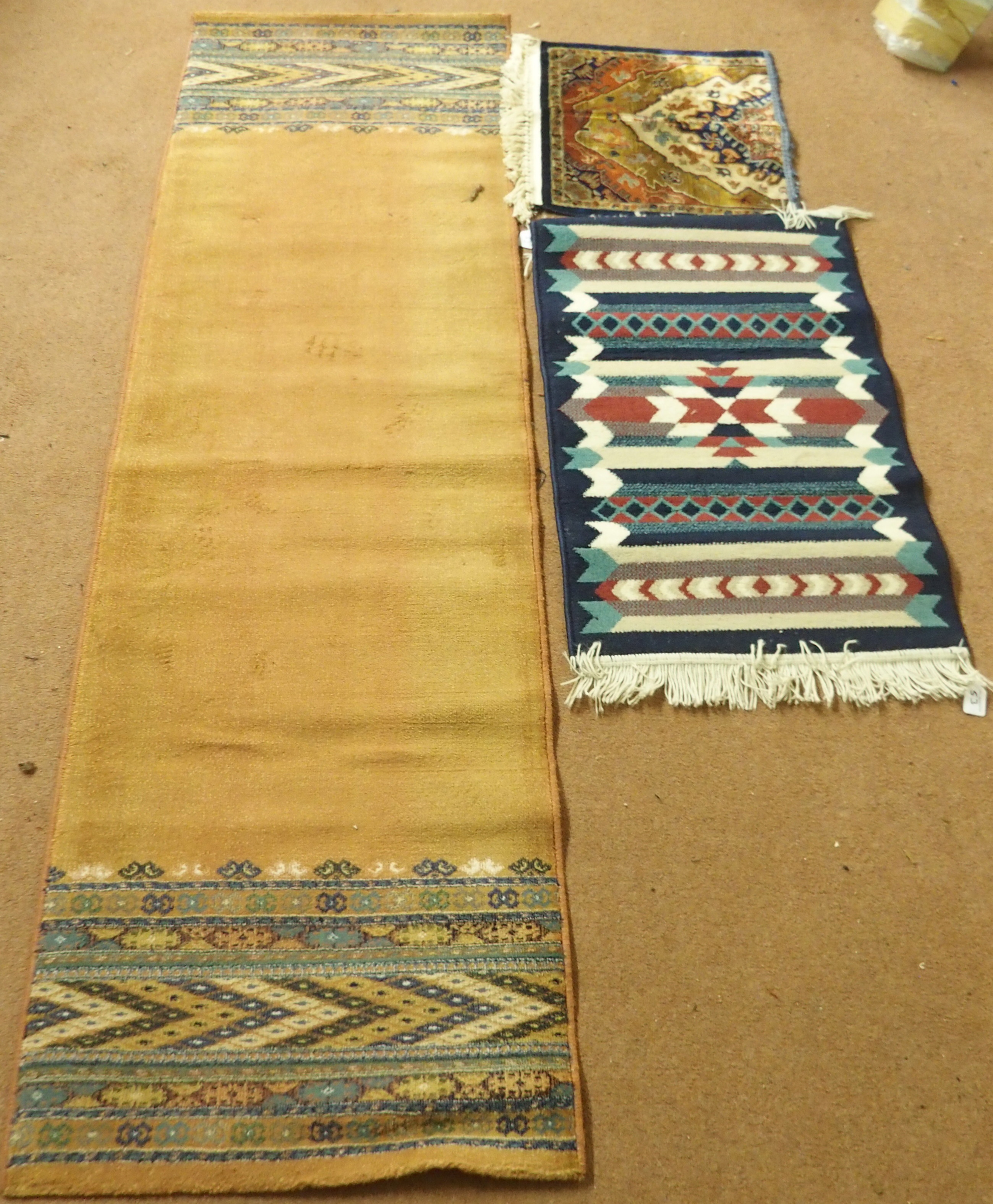 A terracotta ground runner, 233cm x 68cm wide, a small rug and a mat (3) Condition Report: