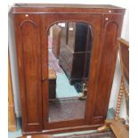 A Victorian mahogany wardrobe with central mirrored door, 192cm high x 140cm wide x 53cm deep