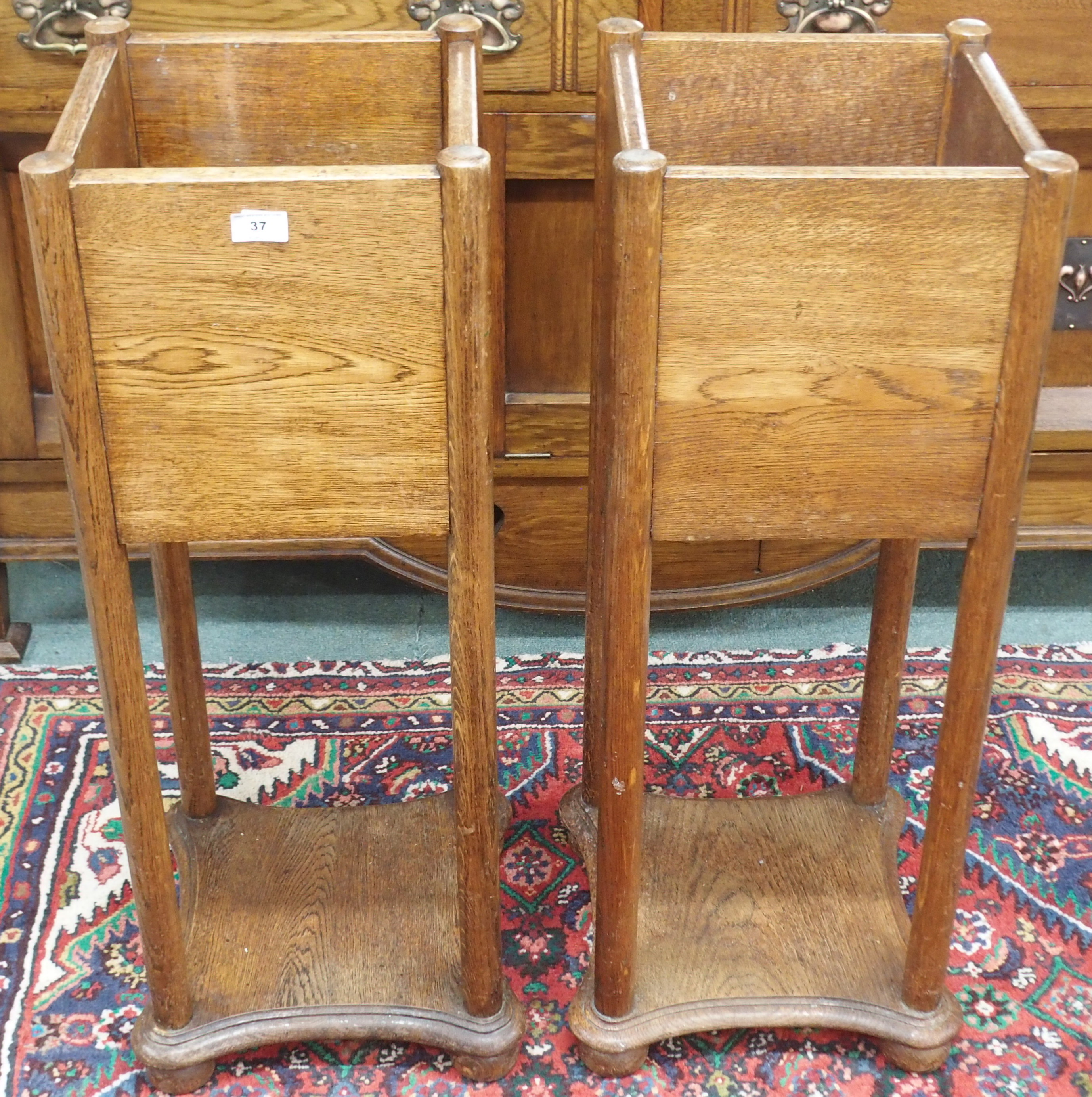 A pair of Arts and Crafts oak planters, 92cm high x 32cm wide x deep 32cm (2) Condition Report:
