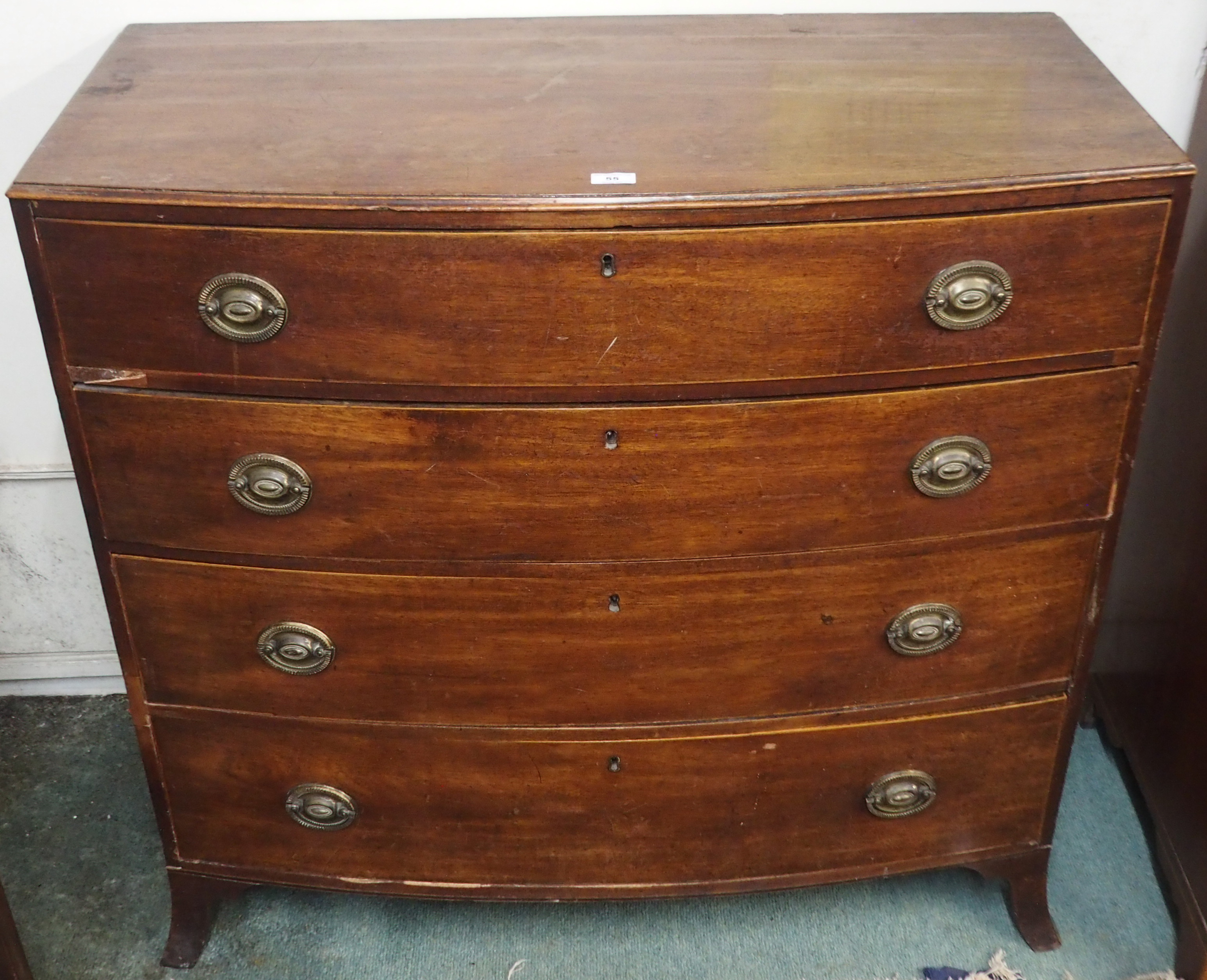 A Georgian mahogany bow front four drawer chest, 102cm high x 107cm wide x 52cm deep Condition