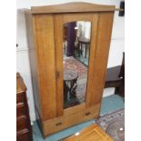 An oak wardrobe with single mirror door and lower drawer, 200cm high x 123cm wide x 53cm deep