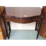 A reproduction mahogany serpentine front tea table with single drawer, 73cm high x 87cm wide