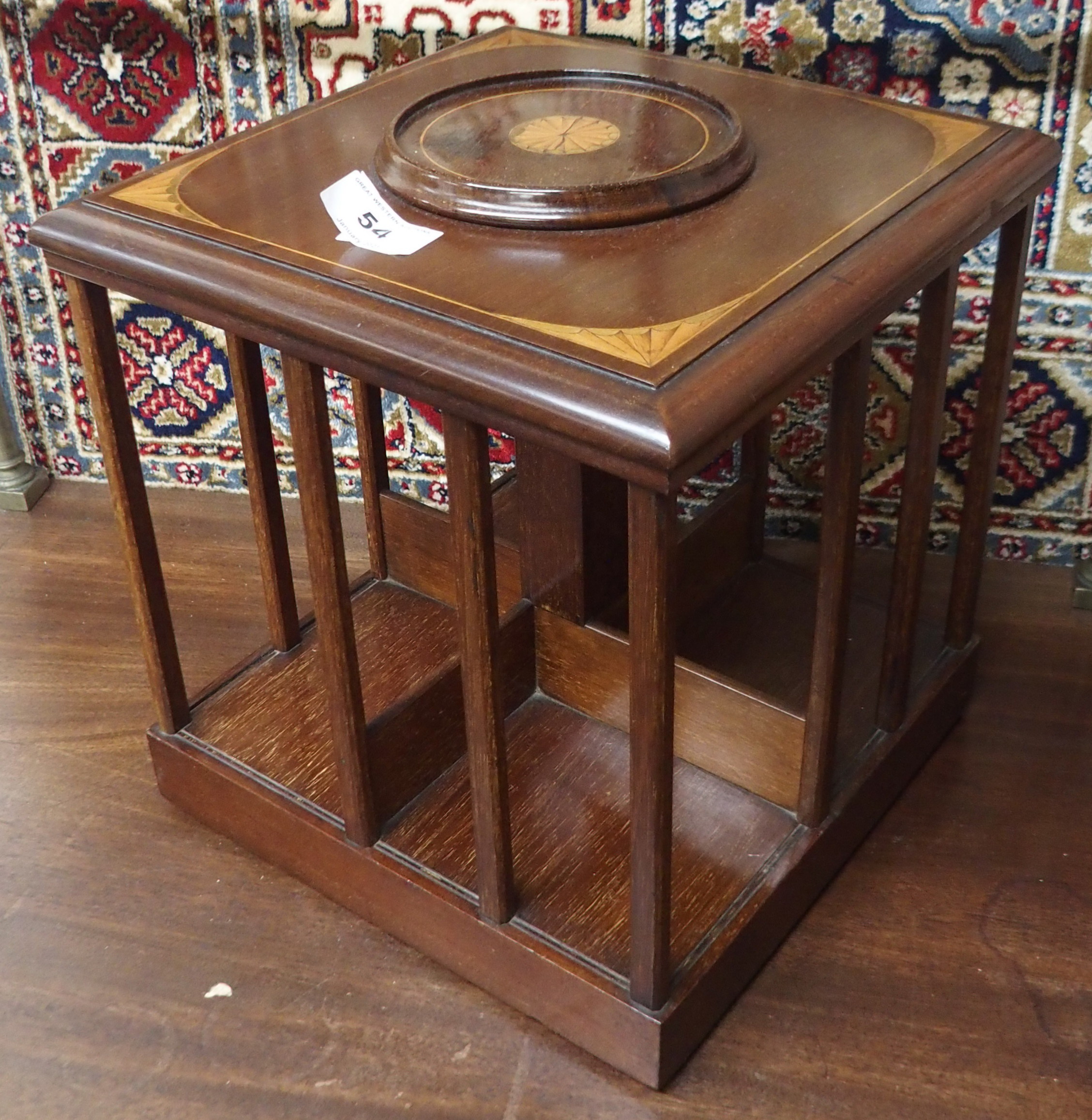 An inlaid mahogany revolving table top bookstand, 28cm high Condition Report: Available upon