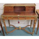 A reproduction writing desk with gilt gallery and three frieze drawers, 96cm high x 94cm wide x 46cm