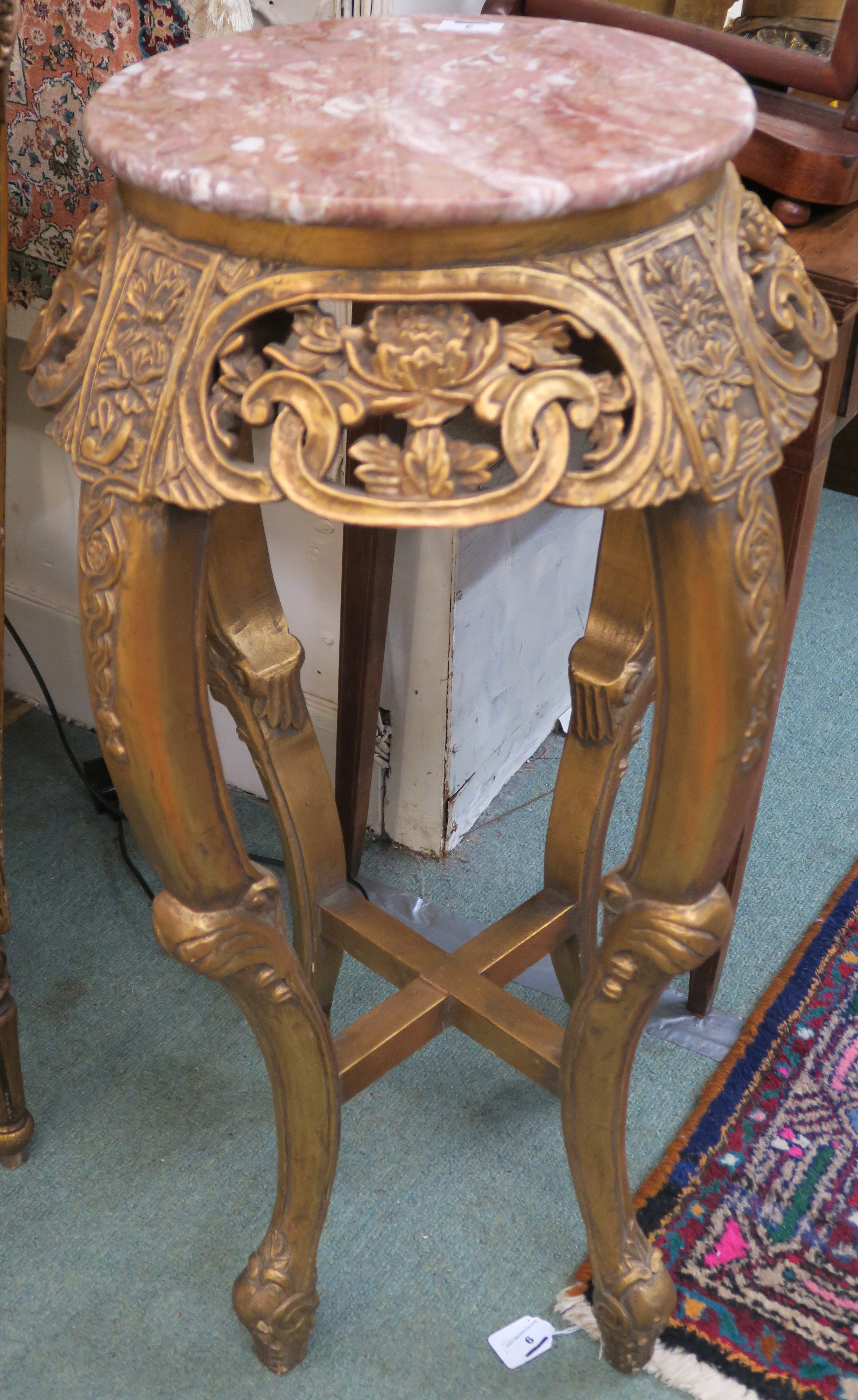 A gilt plant stand with carved frieze and pink marble top, 92cm high Condition Report: Available