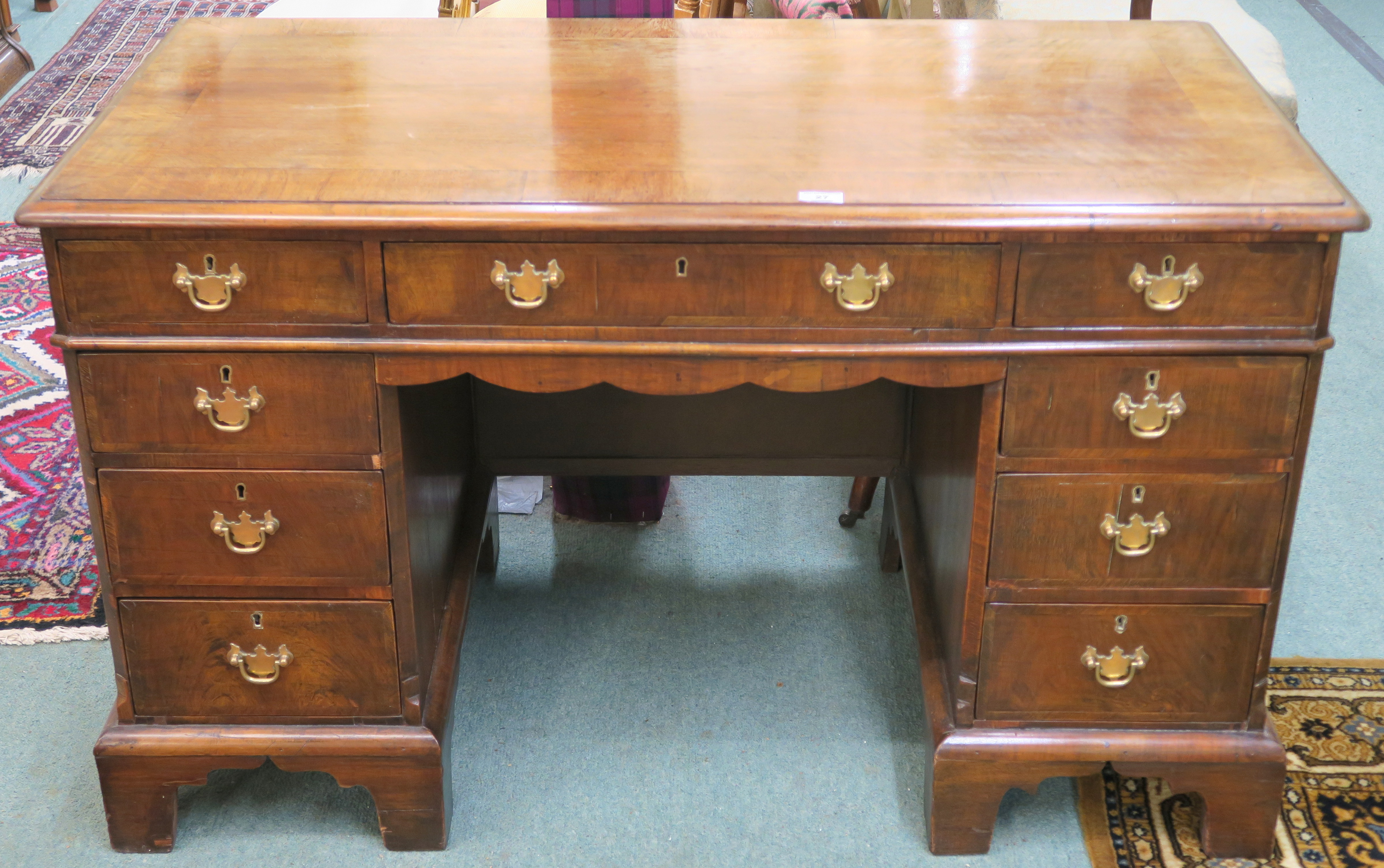 A Georgian style mahogany kneehole desk with bracket feet, 72cm high x 122cm wide x 60cm deep