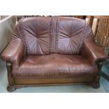 A brown leather two seater sofa with oak frame, 90cm high x 160cm wide x 90cm deep Condition Report: