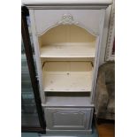 A grey painted cabinet with open shelves with lower door, 206cm high x 84cm wide x 46cm deep