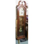 A Howard miller mahogany longcase clock with brass face, 217cm high Condition Report: Available upon