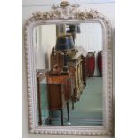 A cream and gilt wall mirror, 135cm high x 84cm wide Condition Report: Available upon request