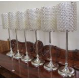 Six candle holders with battery candles , 81cm high (6) Condition Report: Only five candles