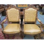 A pair of heavily carved gilt framed armchairs with a golden fabric (2) Condition Report: