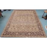 A light brown ground rug with allover floral pattern, 229cm x 289cm Condition Report: Available upon