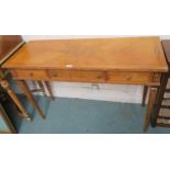 An inlaid desk with three frieze drawers on square tapering legs, 76cm high x 115cm wide x 43cm deep