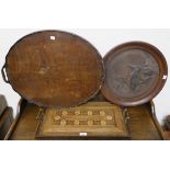 An inlaid tray, oval tray and a carved bird in circular frame (3) Condition Report: Available upon