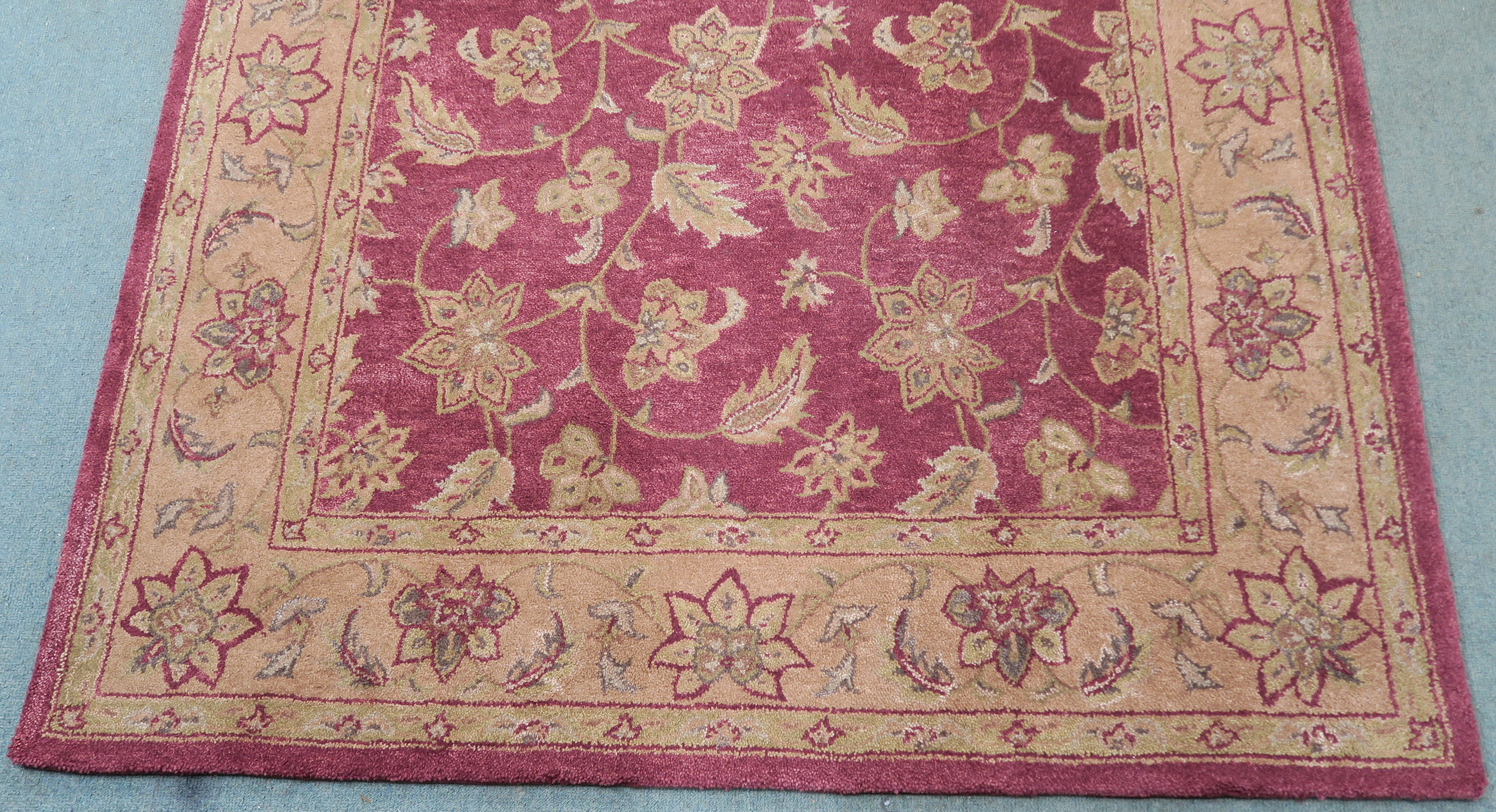 A Burgundy ground wool rug with dark beige floral pattern, 254cm x 160cm Condition Report: Available - Image 2 of 3