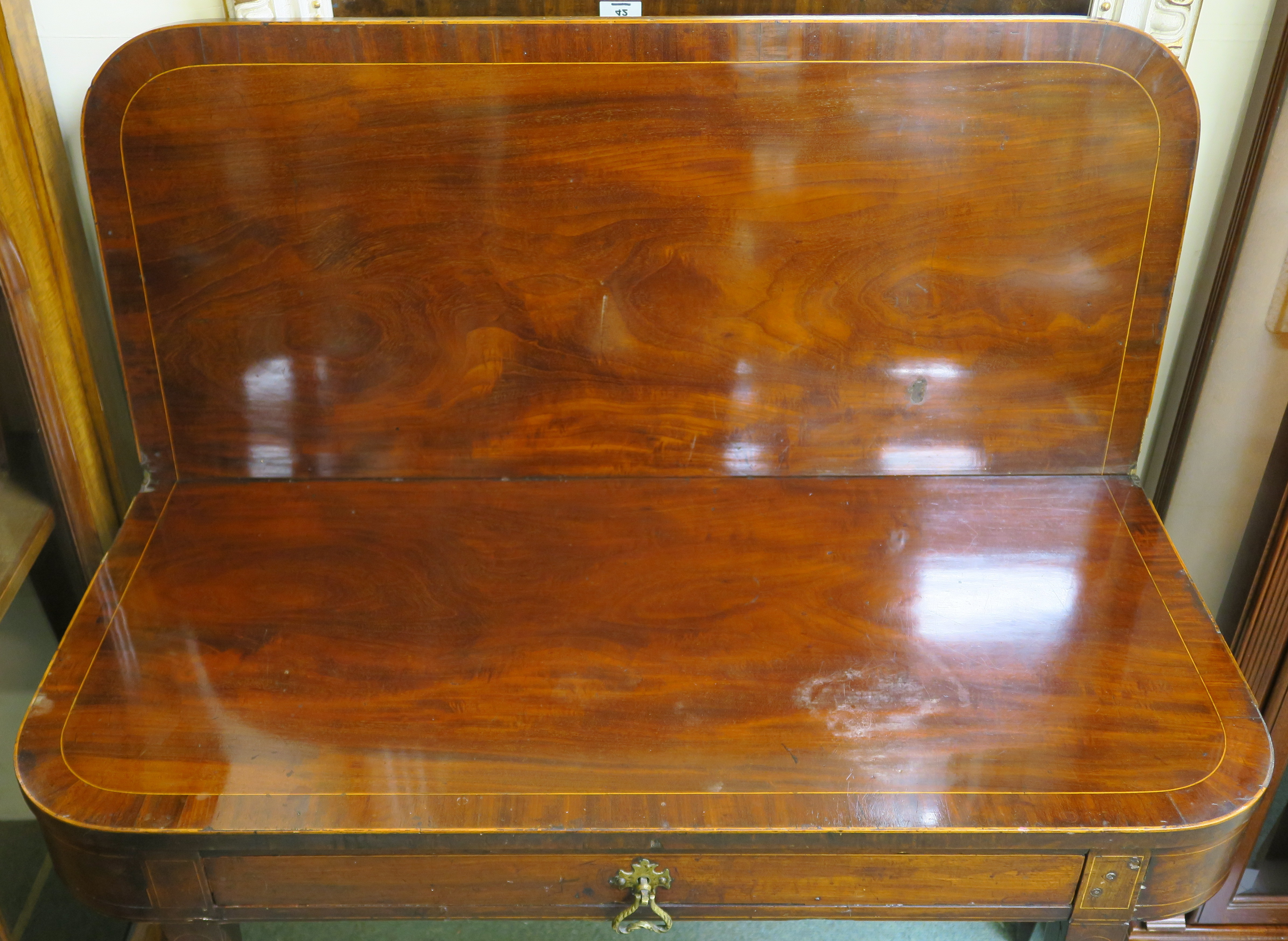 A Georgian mahogany fold over tea table with single drawer, 75cm high x 101cm wide x 46cm deep - Image 2 of 2