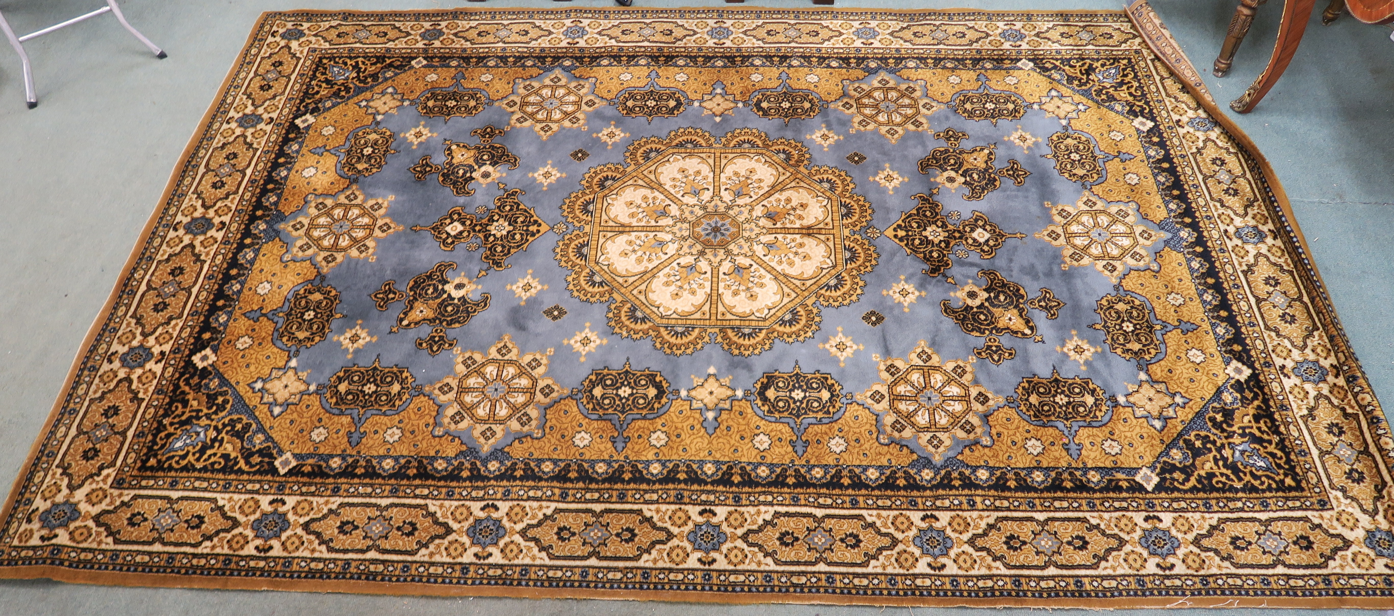 A blue ground Louis de Poortere rug with central medallion, 200cm x 300cm Condition Report: