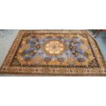 A blue ground Louis de Poortere rug with central medallion, 200cm x 300cm Condition Report: