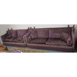 A large purple upholstered drop end three seater sofa, 102cm high x 254cm wide x 100cm deep and a