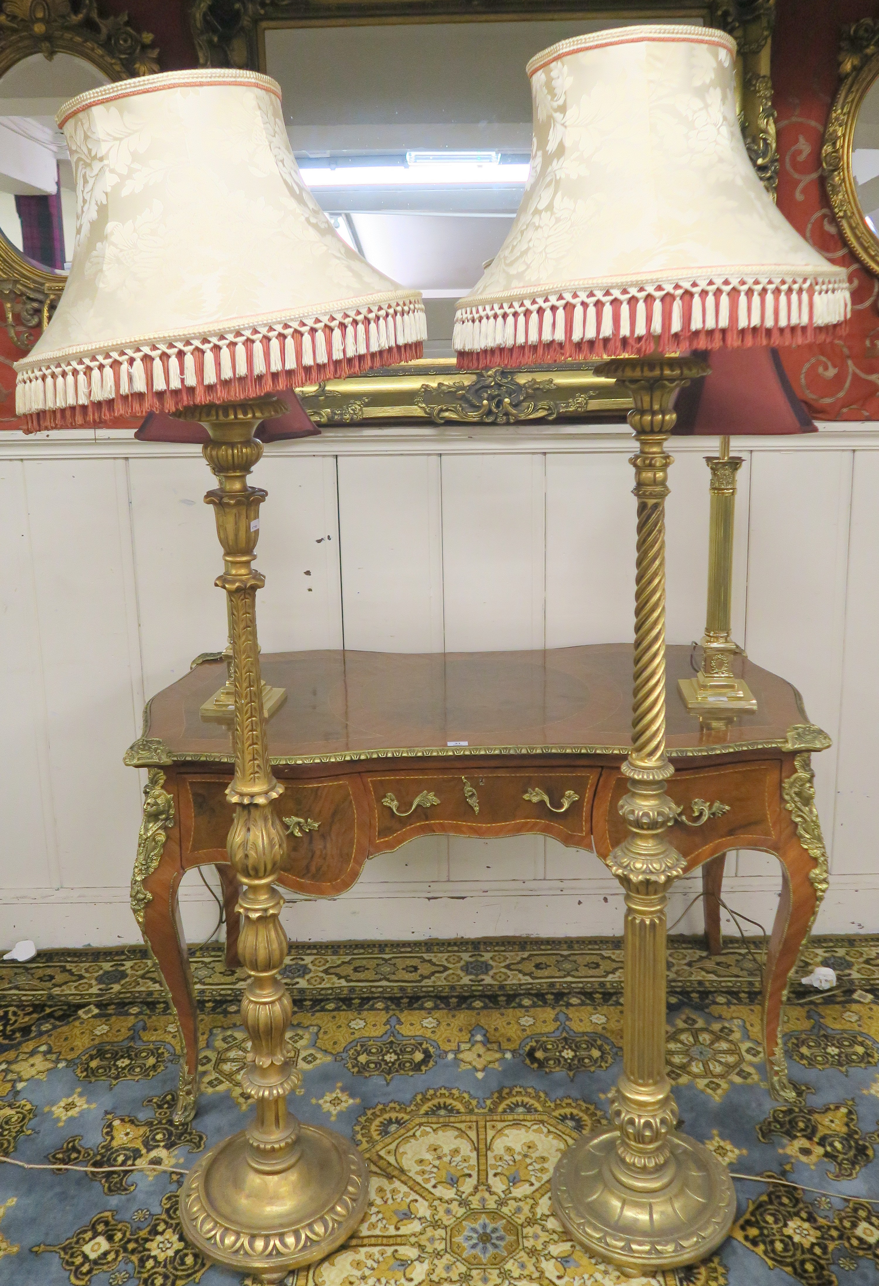 Two gilt standard lamps (2) Condition Report: Available upon request