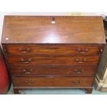 A Georgian mahogany bureau with four graduating drawers on bracket feet, 115cm high x 123cm wide x