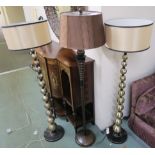 A pair of modern standard lamps and another standard lamp (3) Condition Report: Available upon