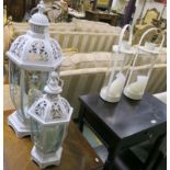 Two white candle lanterns and a pair of cream candle lanterns (4) Condition Report: Available upon