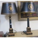 A pair of black and gilt column table lamps 79cm high (one def) (2) Condition Report: Available upon