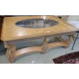 A large coffee table with oval glass inset, 52cm high x 127cm wide x 82cm deep Condition Report: