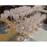 Sixteen candle holders, 34cm high and eleven similar smaller candle holders, 25cm high (27)