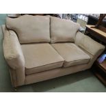 A beige two seater sofa, 95cm high x 168cm wide x 102cm deep Condition Report: Available upon