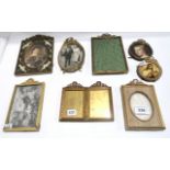A collection of gilt metal frames with ribbon bows and laurel swags and a twin frame retailed by R