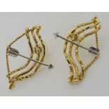 A pair of 9ct yellow and white gold bow and arrow earrings weight 11.1gms, dimensions approx 3.7cm x
