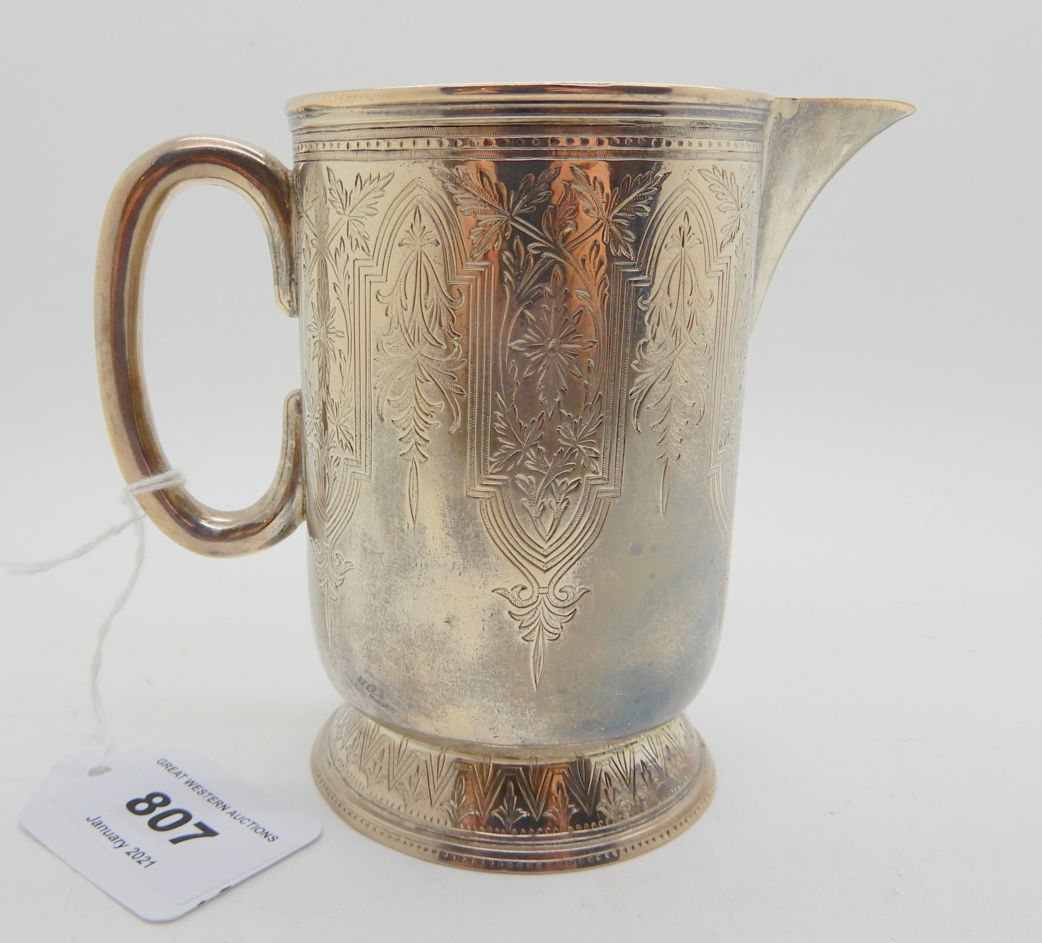 *WITHDRAWN* A Victorian silver jug, Edinburgh 1875, of cylindrical form with foliate and