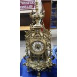 A gilt metal clock with Roman numerals, battery movement, 56cm high Condition Report: Available upon
