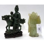 A dark green hardstone figure of a sage and boy with a fo dog, 19cm high together with a paler green