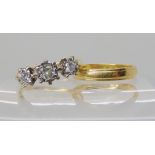 An 18ct gold three stone diamond ring set with estimated approx 0.25cts of brilliant cut diamonds,