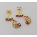 A pair of bright yellow metal ruby and diamond drop earrings, stamped 750 to the butterflies, length