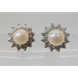 A pair of diamond and pearl stud earrings, diameter 10.6mm, pearls approx 5.6mm, weight 3gms