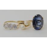 A 9ct gold three clear gem set ring, size R, a 9ct blue glass gem set ring size O and a 9ct twin