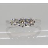 An 18ct white gold and platinum three stone diamond ring, set with estimated approx 0.33cts of old