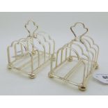 A pair of silver four-section toast racks on four ball feet, Sheffield 1913, 187gms Condition