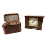 An Elliot clock, retailed by Edward, Glasgow and walnut teacaddy Condition Report: Available upon