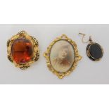 A yellow metal and enamel brooch set with a large glass Cairngorm, and other items Condition Report: