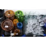 A collection of coloured glass storage jars, South American etched glasses and other drinking