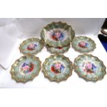 An Aynsley dessert service comprising six plates, 20cm diameter and a serving dish, painted with
