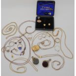 A collection of gold plated items to include guard chains, fobs etc Condition Report: Not