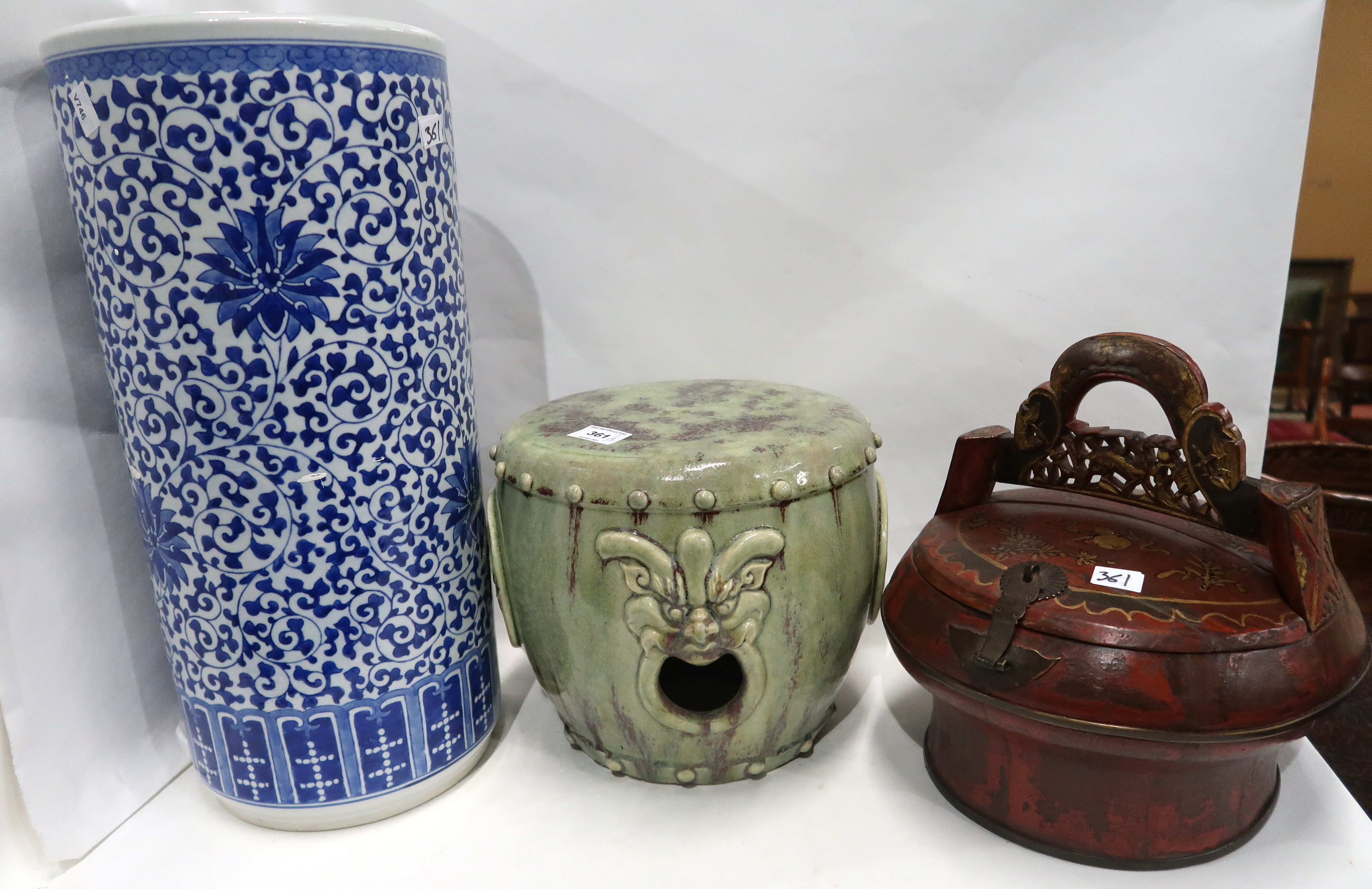 A Chinese green glazed stool, 23cm high, a blue and white umbrella stand and a painted food