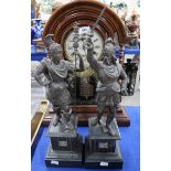 A pair of spelter figures of warriors and a wooden American mantle clock Condition Report: Available